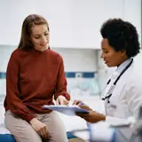 Doctor talking with patient